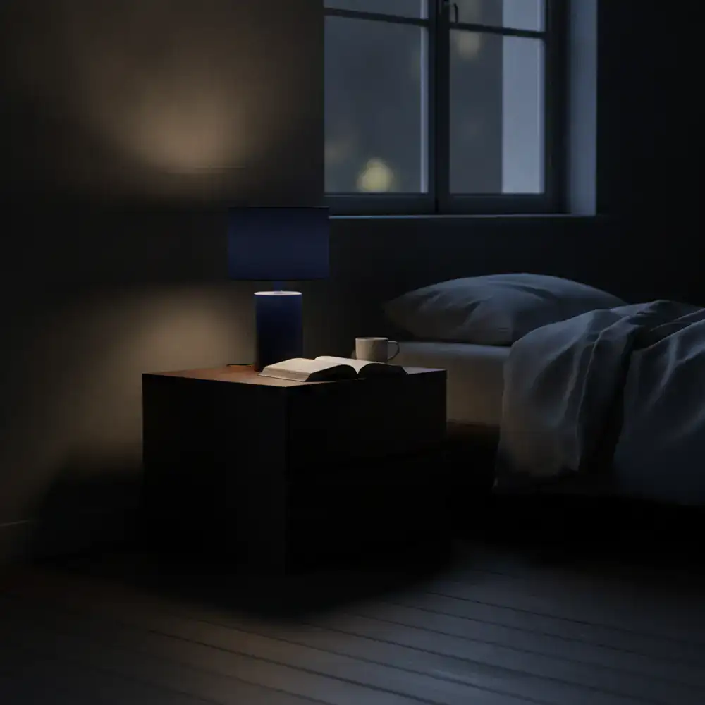 Midnight blue minimalist lamp on a bedside table